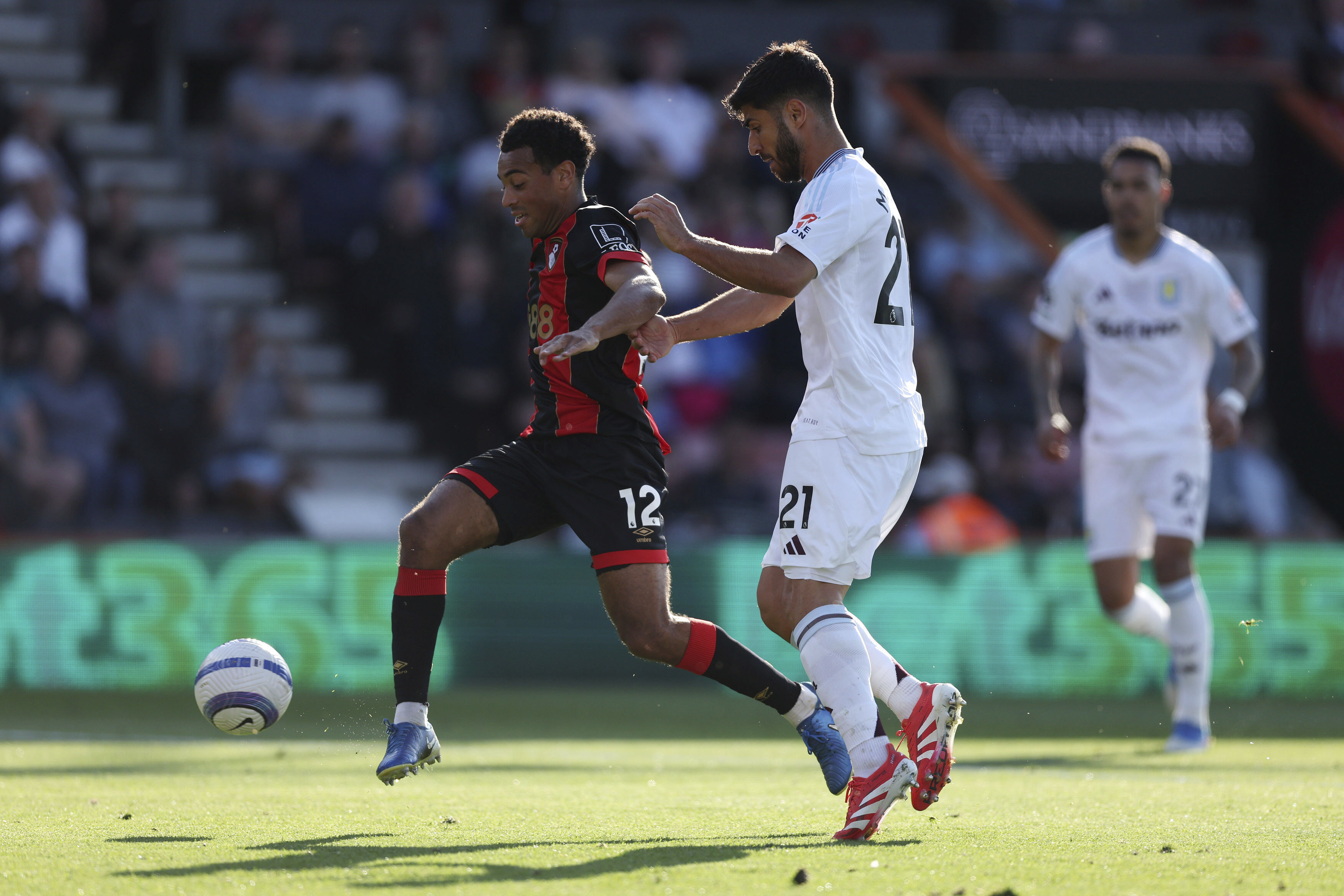 Aston Villa's Marco Asensio and Bournemouth's Tyler Adams, left, battle for the ball during the English Premier League soccer match between Bournemouth and Aston Villa at the Vitality Stadium, Bournemouth, England, Saturday May 10, 2025. 