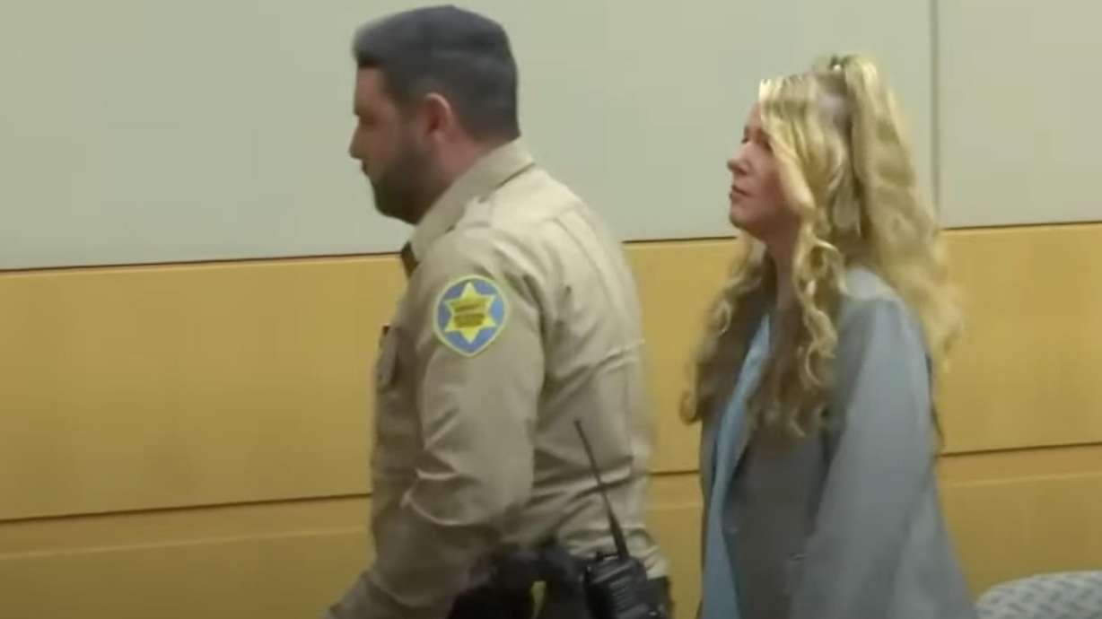 Lori Daybell is walked out of court on Friday after she spoke over the judge, accused him of yelling at her. She is on trial this week for the shooting of Brandon Boudreaux in 2019.