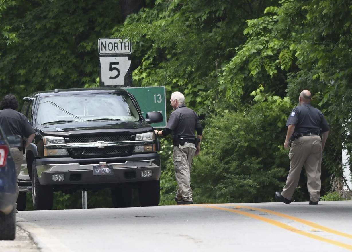 Police set up checkpoints looking for escaped prisoner Grant Hardin, May 29, 2025, near downtown Calico Rock, Ark.