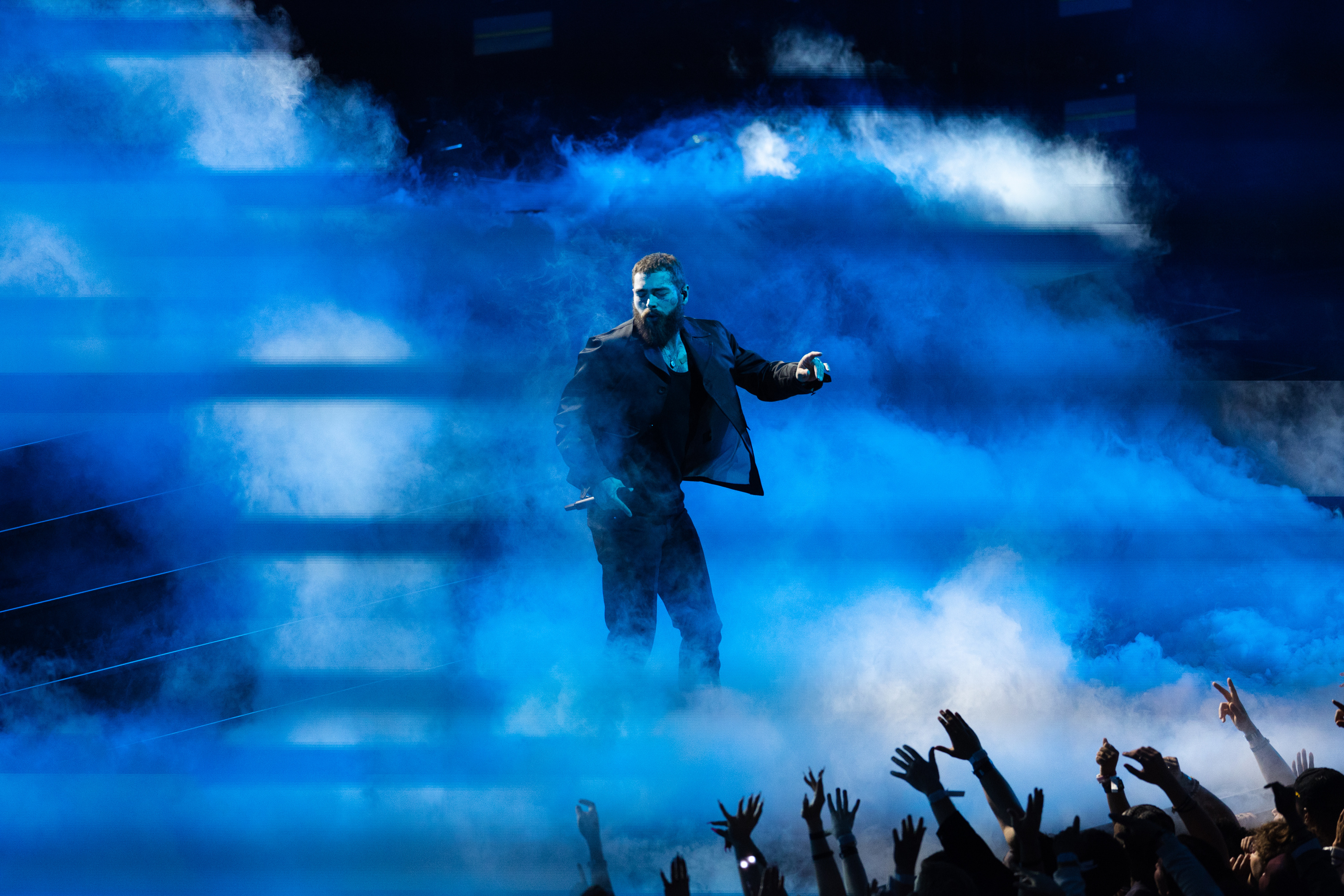 Post Malone performs during the NBA All-Star Game in Salt Lake City on Feb. 19, 2023. Post Malone is one of three headlining artists at Redwest Music Festival in Salt Lake City in October, event organizers announced on Monday.