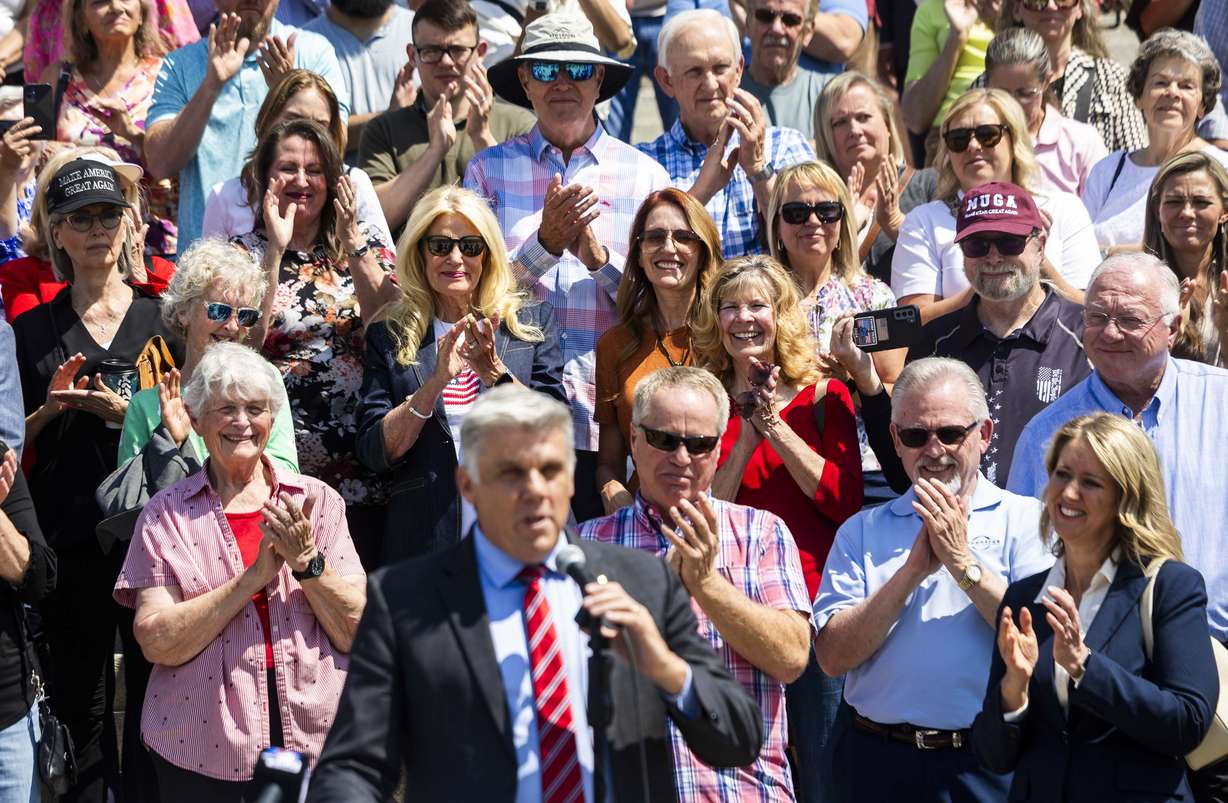 Phil Lyman supporters clap and cheer behind him while he speaks at a press conference announcing a lawsuit to require Utah Lt. Gov. Deidre Henderson to give Lyman a copy of the Statewide Voter Registration List, at the Capitol in Salt Lake City on Friday.
