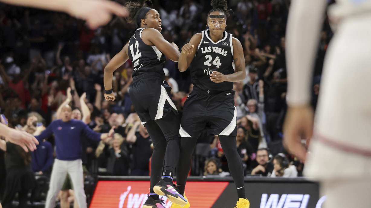 Las Vegas Aces guard Jewell Loyd (24) celebrates with teammate Chelsea Gray (12) after scoring the game-winning basket against the Washington Mystics during the second half of a WNBA basketball game Friday, May 23, 2025, in Las Vegas.