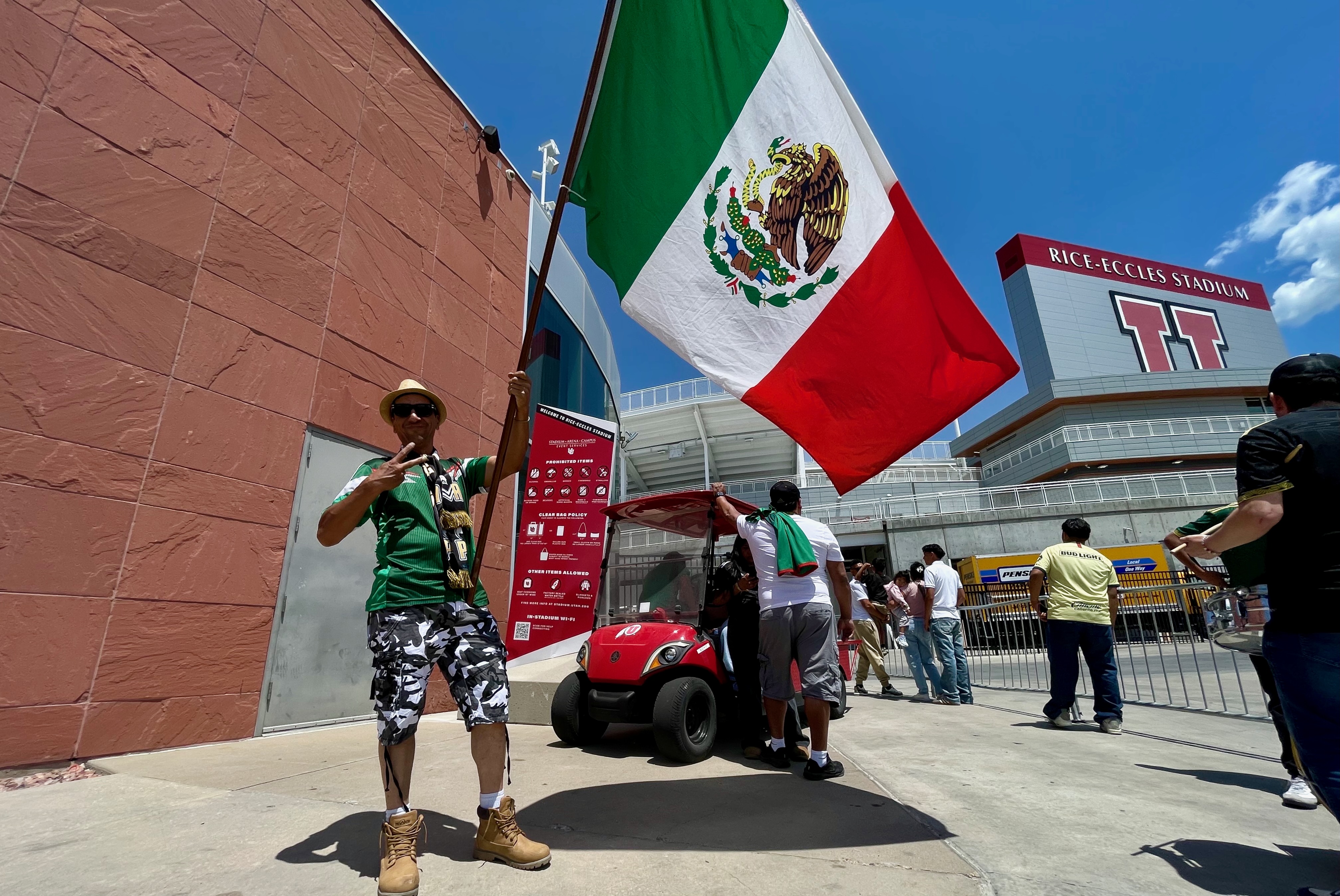 Carlos Dominguez stands outside Rice-Eccles Stadium in Salt Lake City with a handful of other fans of the Mexican national soccer team on Friday. Mexico plays Switzerland in the stadium on Saturday.