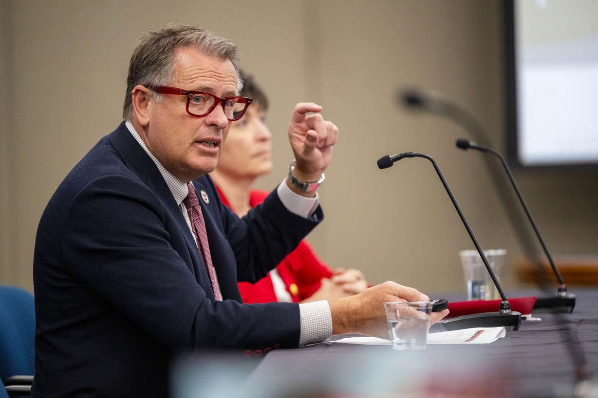 University of Utah President Taylor Randall and Senior Vice President for Academic Affairs Mitzi Montoya speak to the Utah Board of Higher Education in South Salt Lake Friday. Randall affirmed Friday his commitment to his vision of the school becoming an "impact university."