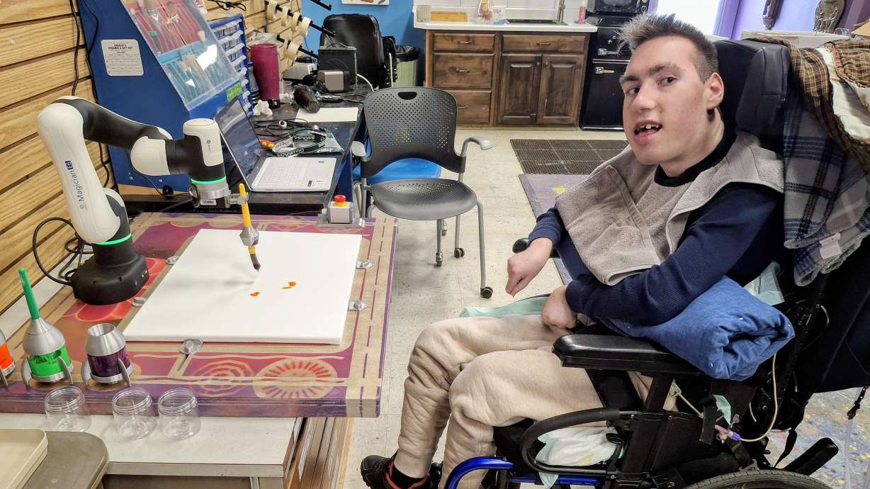 The new robotic arm being used by one of Jump The Moon's artist. The unique technology allows artists of all abilities to enjoy creativity.