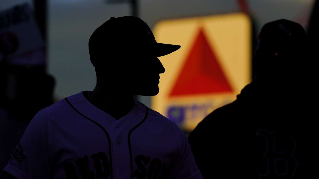 FILE-Fans arrive at Fenway Park in this, Oct. 19, 2021 file photo, in Boston.