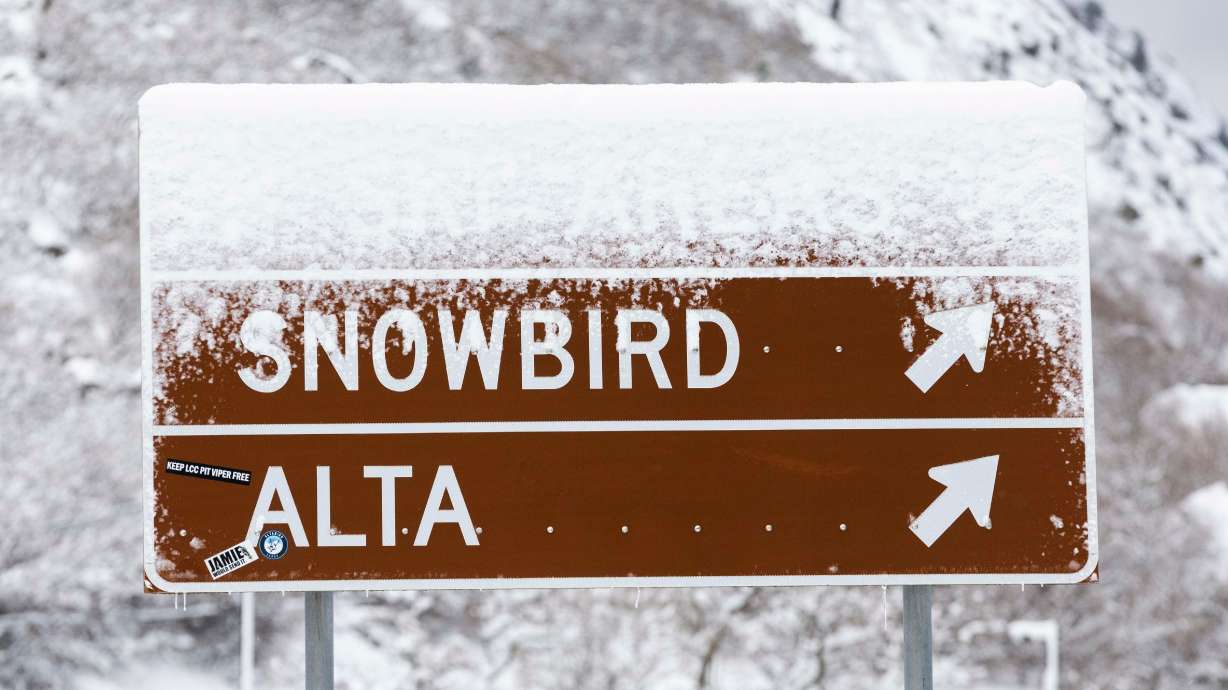 Snow covers a sign directing drivers to ski resorts at the entrance to Little Cottonwood Canyon on Jan. 4. Some ski areas put up solid, even impressive totals for the season.
