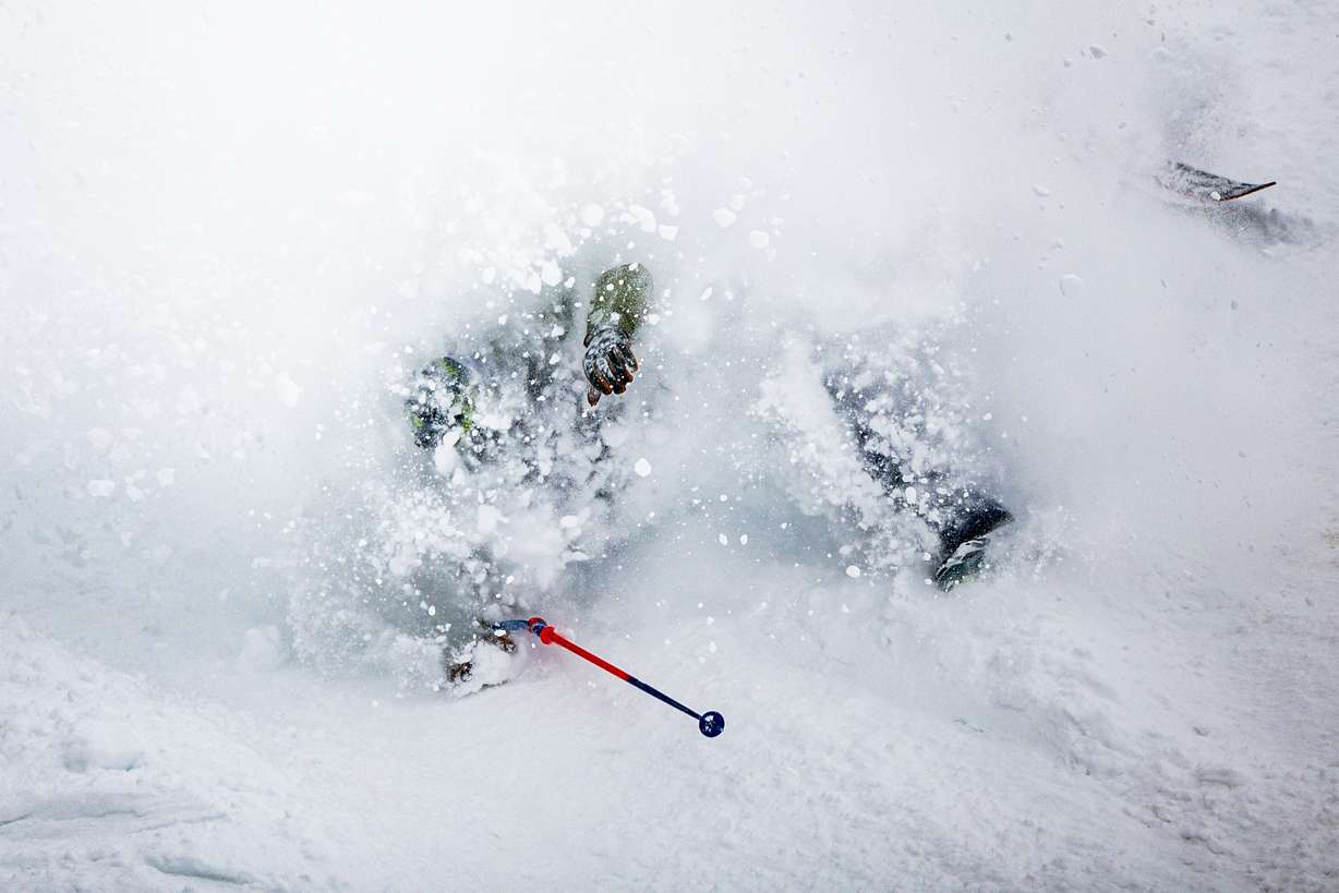 A person crashes while skiing in fresh snow at Solitude Mountain Resort in Brighton on March 6.