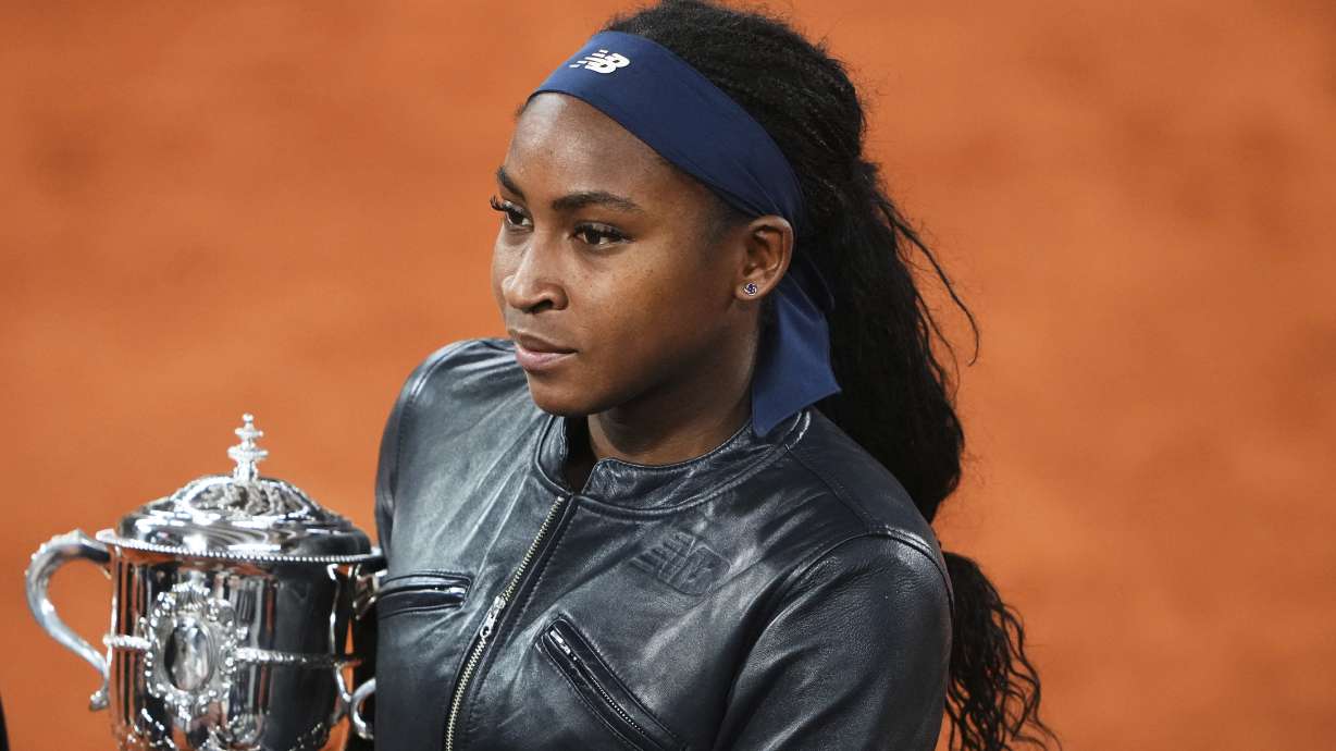 Coco Gauff of the U.S. holds the trophy while being interviewed after winning the final match of the French Tennis Open against Aryna Sabalenka of Belarus at the Roland-Garros stadium in Paris, Saturday, June 7, 2025.
