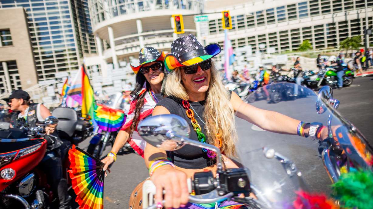 People prepare to take part in the annual Utah Pride Parade on 100 South in Salt Lake City on Sunday. The event brought in tens of thousands of people.