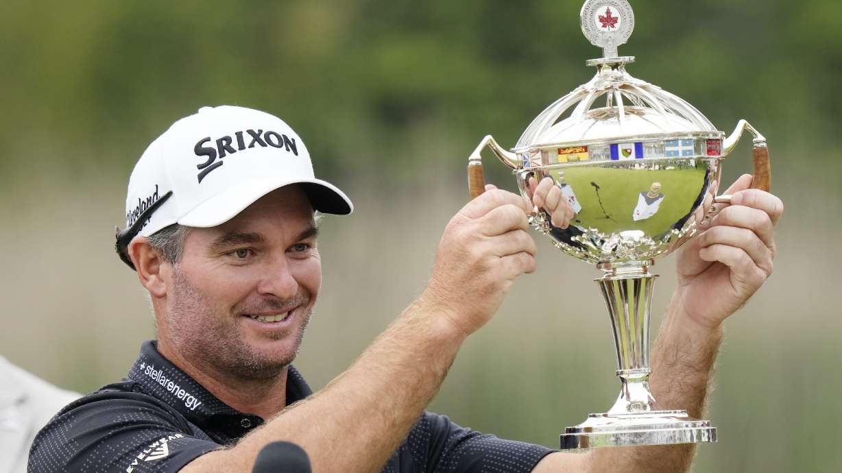 Ryan Fox raises the championship trophy after winning the RBC Canadian Open golf tournament in Caledon, Ontario, Sunday, June 8, 2025.