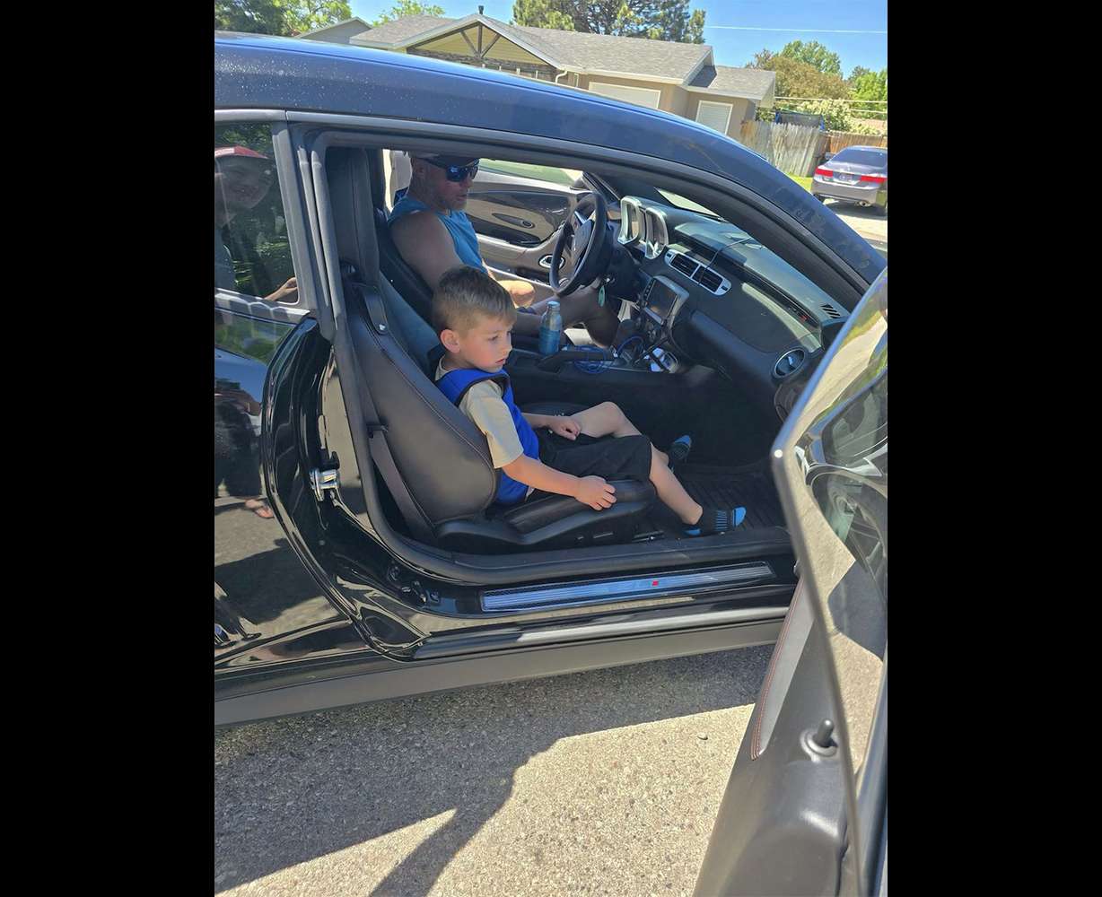 The Snake River Street Kings made an appearance at Brennan Havens's birthday party with their cars. Brennan sits inside a car that showed up for his birthday.