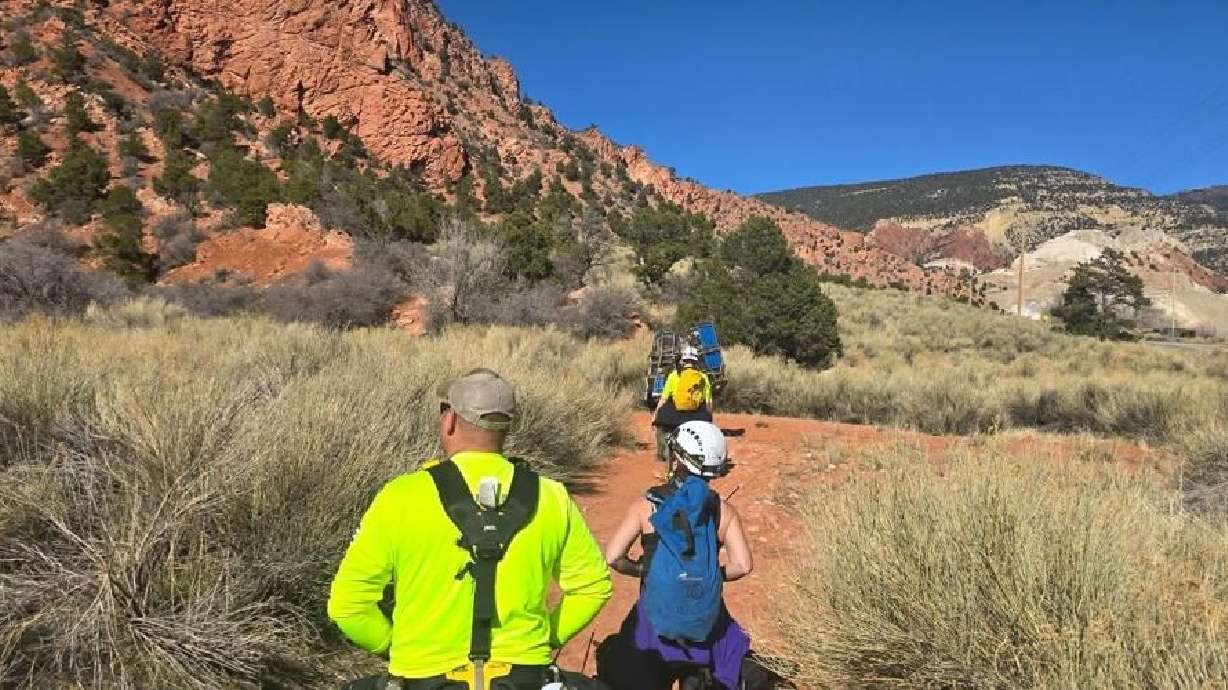 Iron County Search and Rescue team members hike toward the location of a stranded teenager in Iron County, April 6.