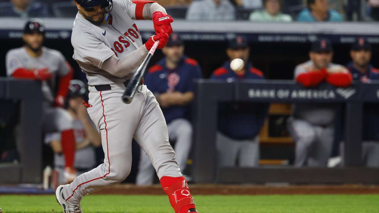 Boston Red Sox's catcher Carlos Narváez hits a three run home run against the New York Yankees during the sixth inning of a baseball game, Sunday, June 8, 2025, in New York.
