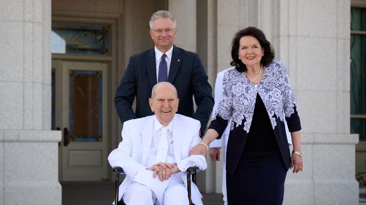 President Russell M. Nelson and his wife, Wendy, exit the Syracuse Utah Temple following the dedication ceremony on Sunday. The 100-year-old church president gave the dedicatory prayer for the temple and promised several blessings of peace, protection and personal revelation for those who worship in the new temple.