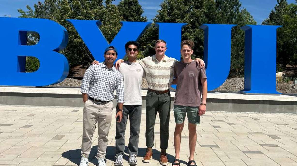 Perry Rockwood, in stripes, with some of his students.