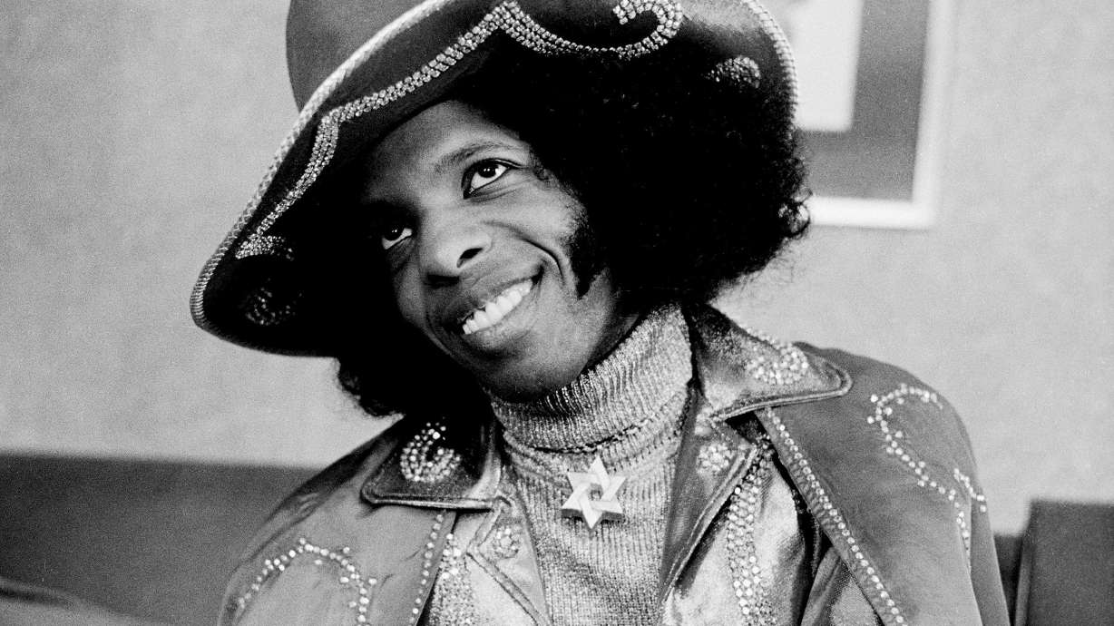 Sly Stone poses for a photo in London in 1973. Stone's family announced he died on Monday.