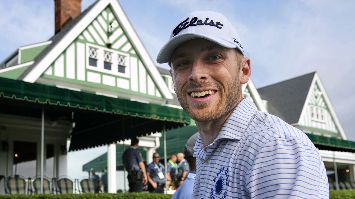 Matt Vogt walks past the clubhouse to the first tee for a practice round for the 2025 US Open golf championship at Oakmont Country Club in Oakmont, Pa. Monday, June 9, 2025.