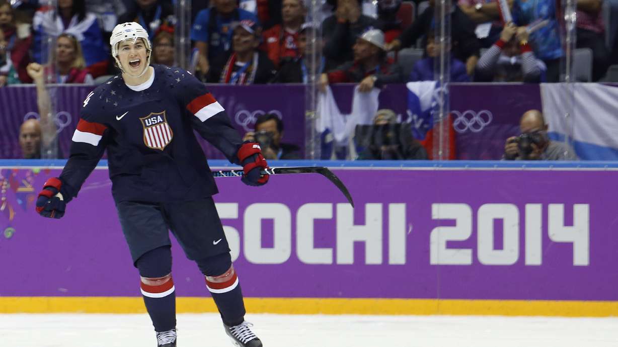 FILE - USA forward T.J. Oshie reacts after scoring the winning goal in a shootout against Russia during overtime of a men's ice hockey game at the 2014 Winter Olympics, Saturday, Feb. 15, 2014, in Sochi, Russia.