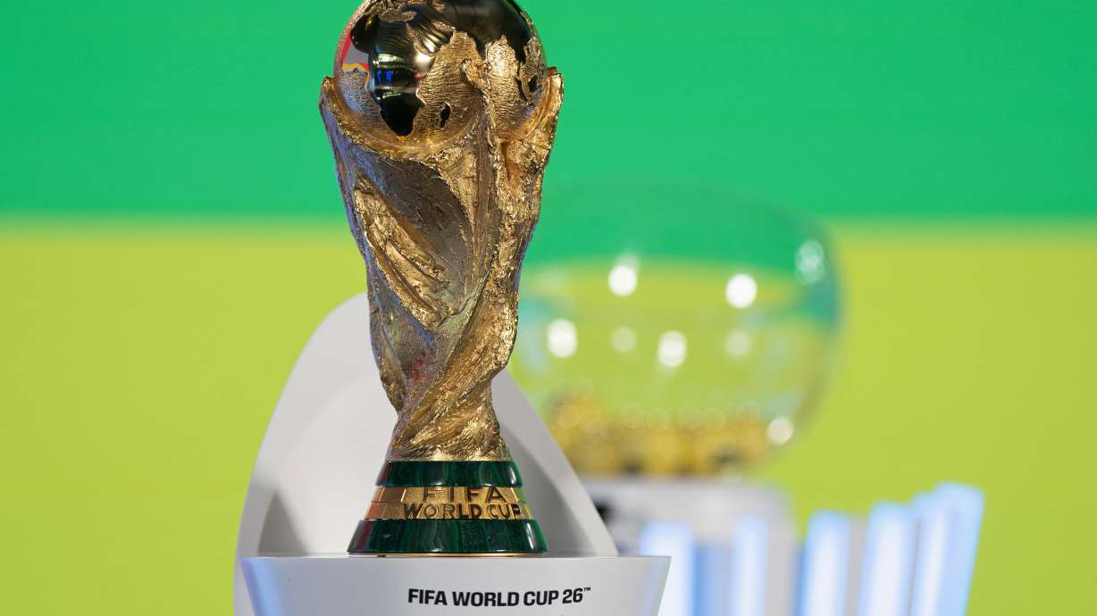 FILE - The World Cup trophy is displayed before the UEFA Preliminary Draw for the 2026 FIFA World Cup soccer tournement at FIFA headquarters in Zurich, Switzerland, Friday, Dec. 13, 2024.
