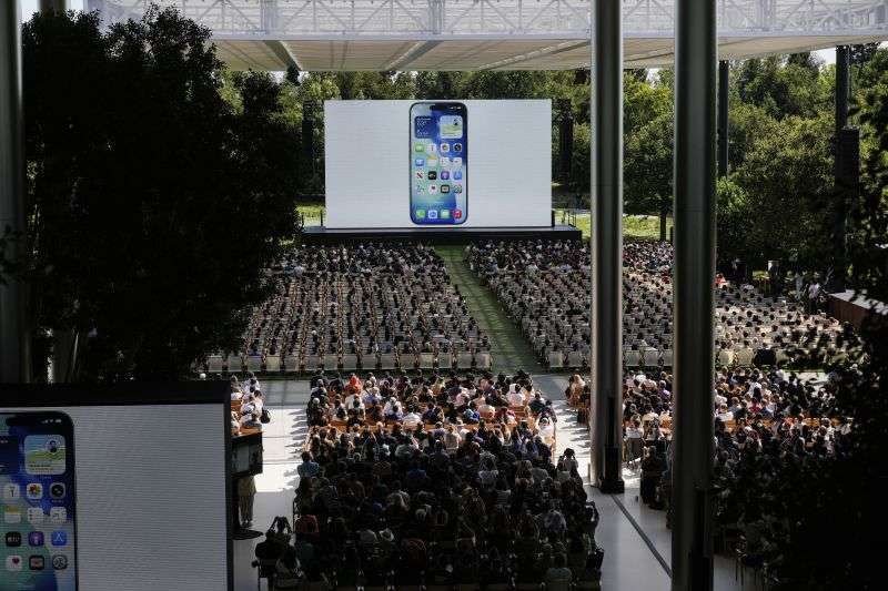 Attendees watch a presentation during an event on the Apple campus in Cupertino, Calif., Monday.