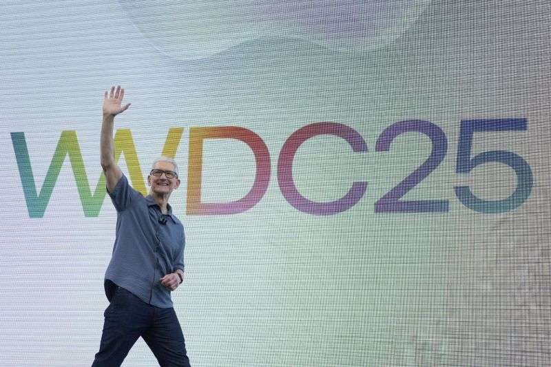 Apple CEO Tim Cook waves to attendees during an event on the Apple campus in Cupertino, Calif., Monday.