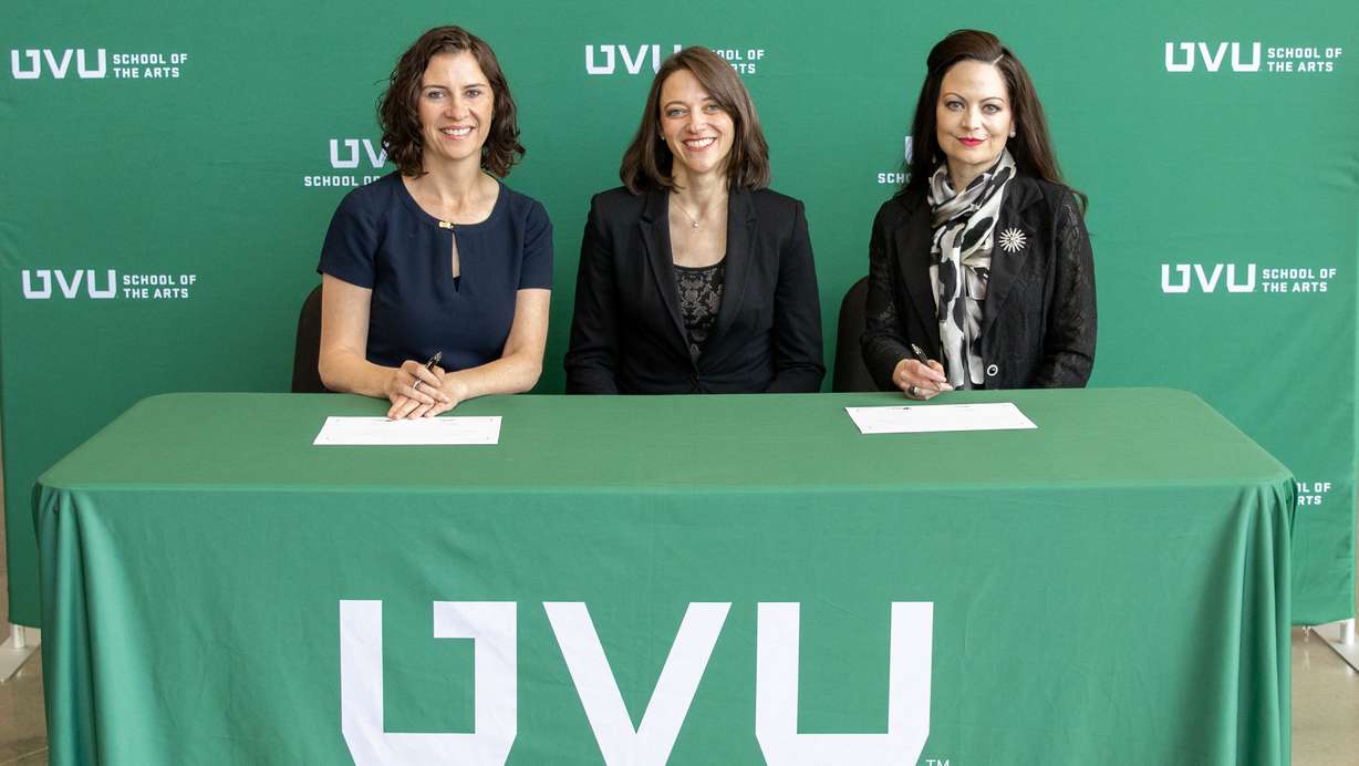 Ballet West's Sarah Taylor and Utah Valley University's Jamie Johnson and Courtney Davis sign papers to implement a partnership to provide Ballet West Academy students the opportunity to earn college credit while training.
