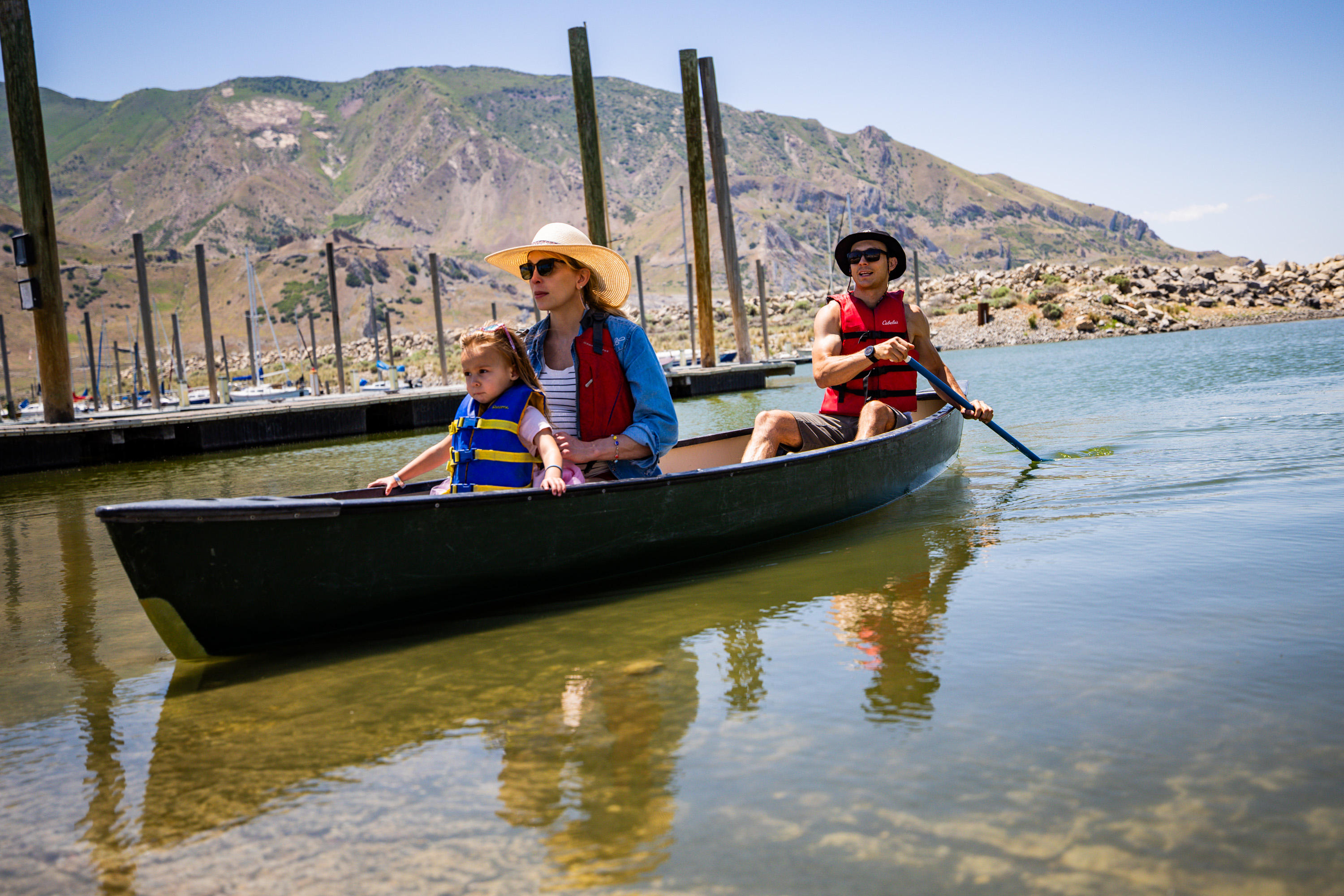 Claire and Tim Gibson and their daughter Elodie Gibson, 2, canoe at Sailfest at the Great Salt Lake on Saturday. Lake levels have already peaked this year and could fall to levels that impact future boating, experts warn.