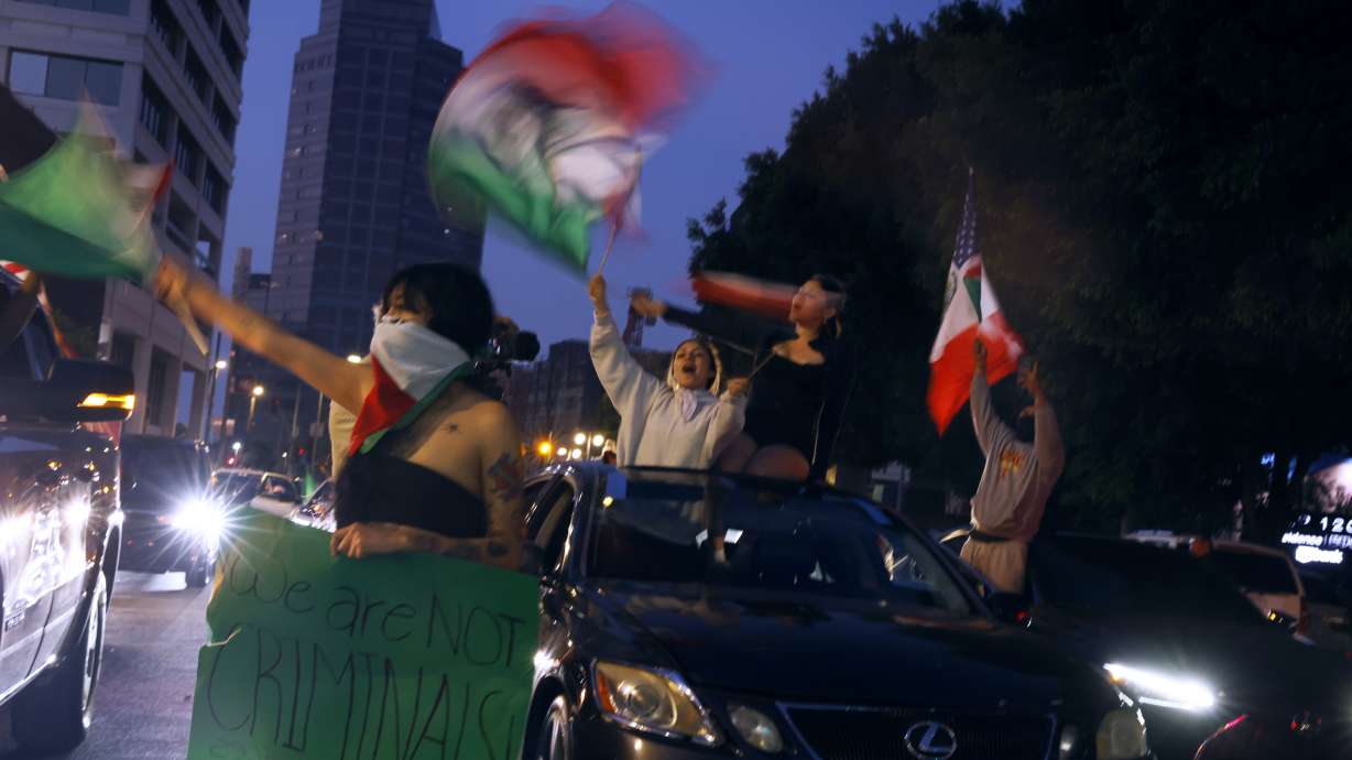 Demonstrators rally during a protest in response to a series of United States Immigration and Customs Enforcement (ICE) raids, in Los Angeles, on Monday, June 9, 2025.