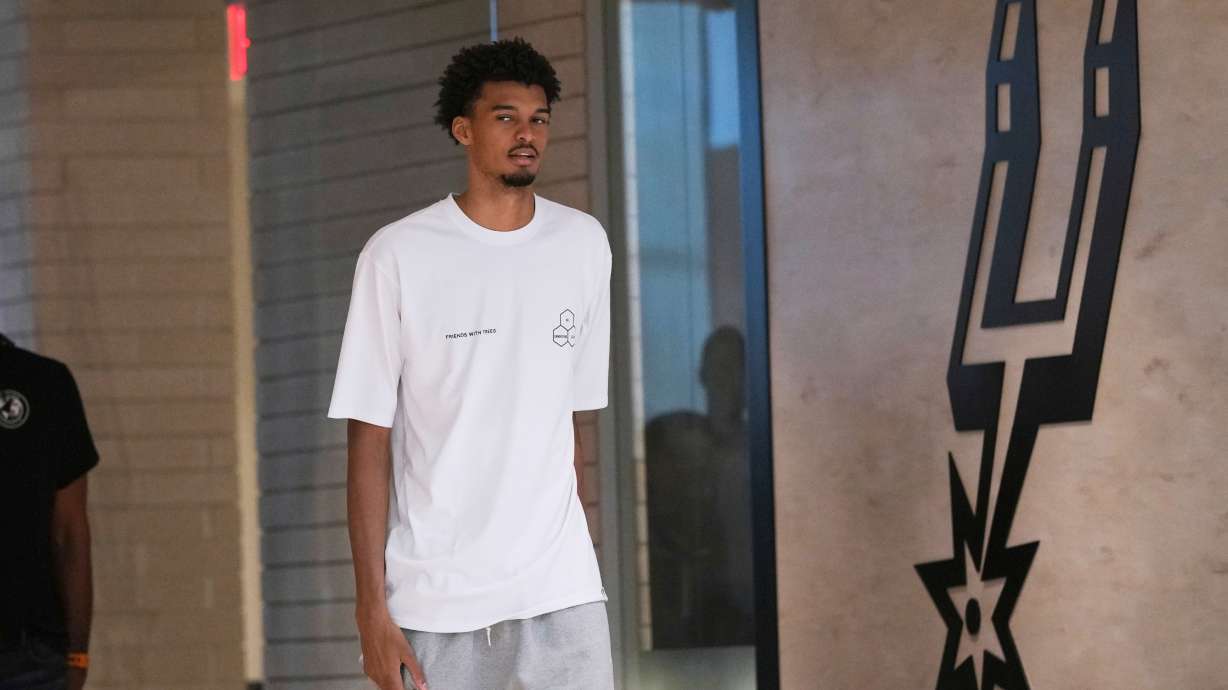 FILE - Spurs' Victor Wembanyama arrives for a news conference in San Antonio, May 5, 2025.