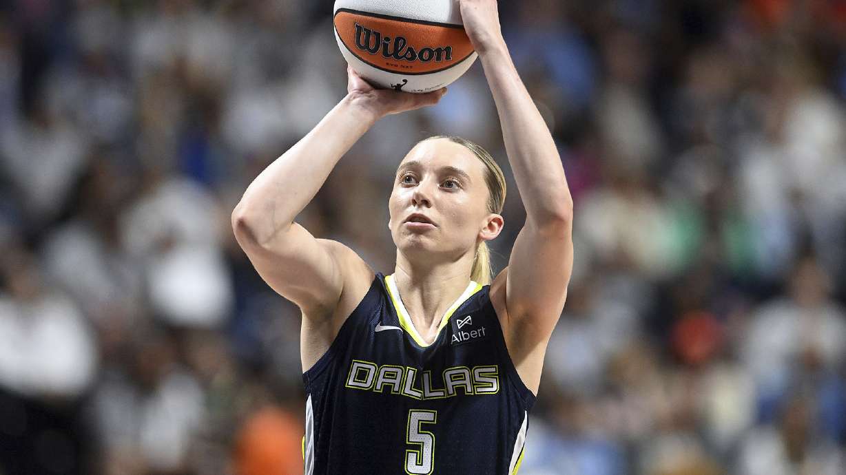 Dallas Wing's Paige Bueckers takes an outside shot on basket during a WNBA basketball game against the Connecticut Sun, Tuesday, May 27, 2025, in Uncasville, Conn.