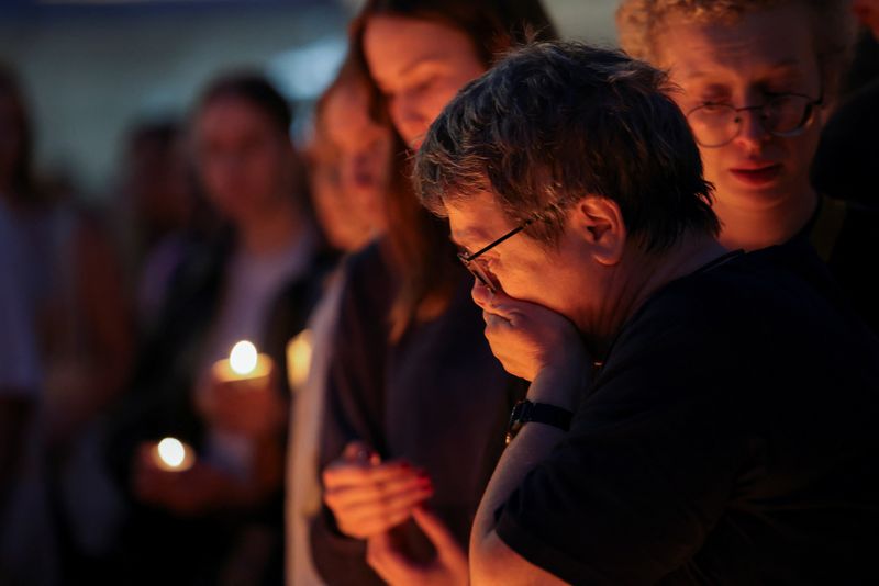 People at a vigil following a school shooting in Graz, Austria, Tuesday. A former student killed 10 people and himself in what was called the worst school shooting in the country's modern history.