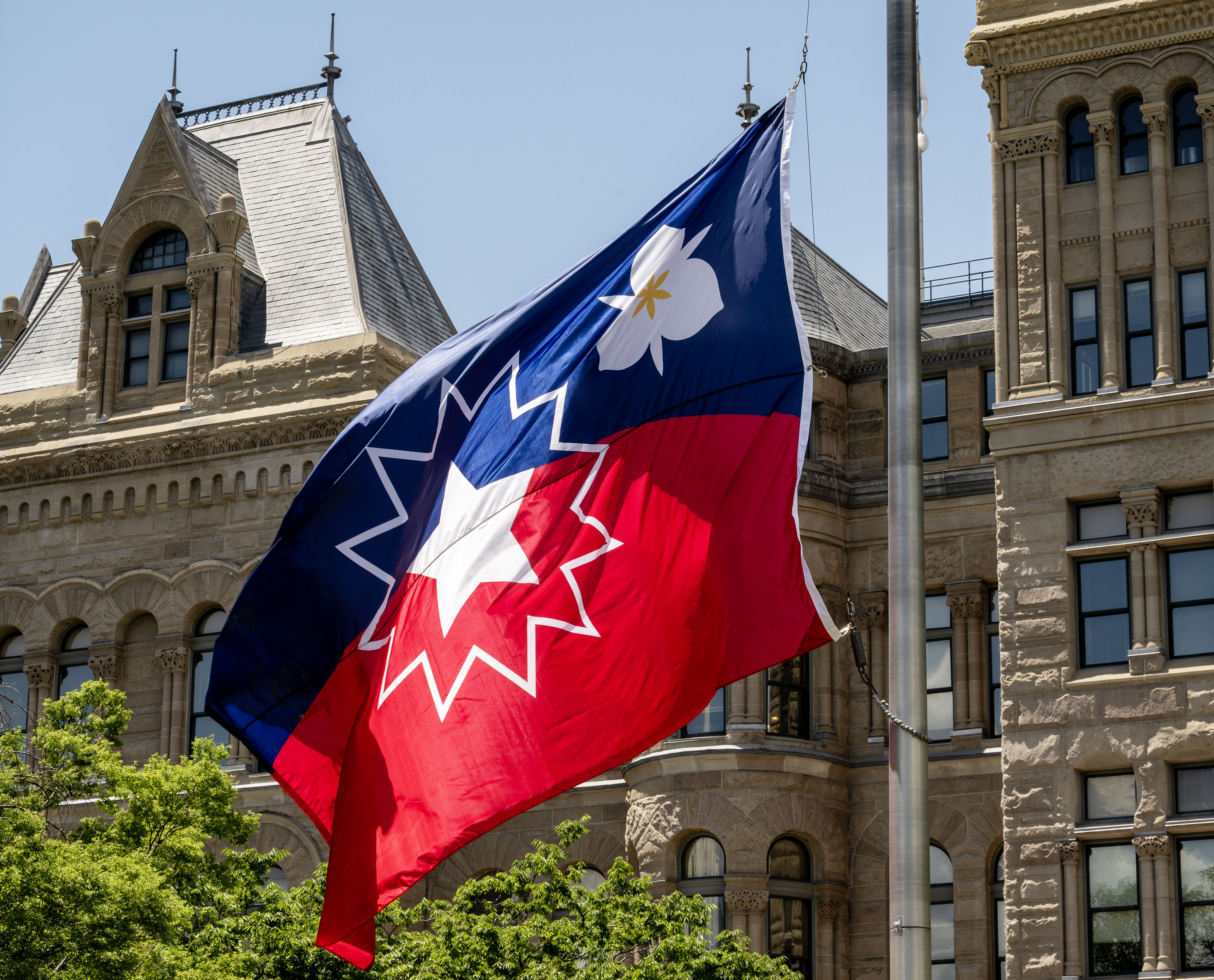 Salt Lake City's Juneteenth-themed flag is raised at an early celebration of Juneteenth at City Hall, Tuesday. The event included the reading of General Order No. 3 and the inaugural raising of the Sego Celebration flag, as well as other speakers.