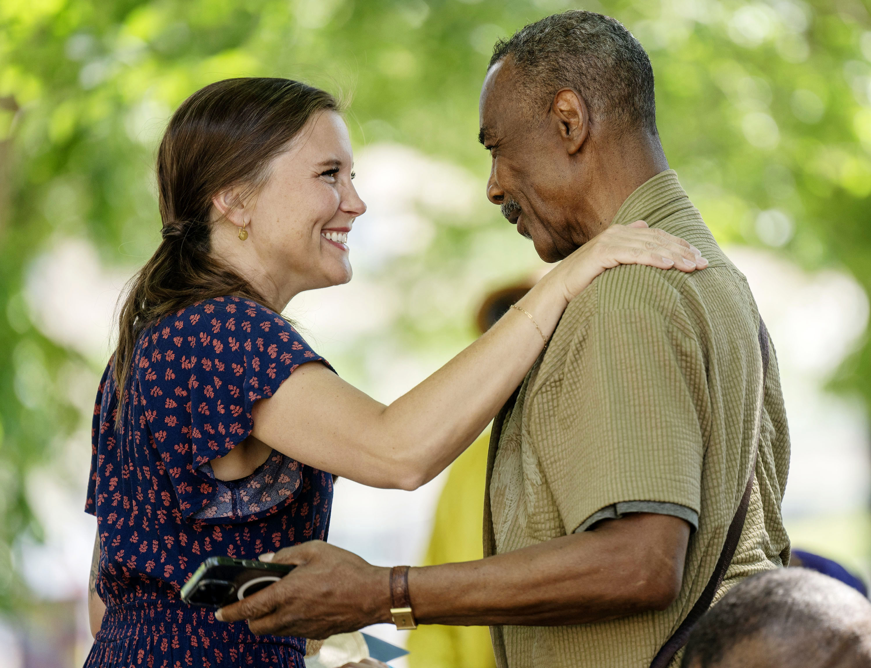 Salt Lake City Mayor Erin Mendenhall greets James Brown as she and other city officials joined community leaders for an early celebration of Juneteenth at City Hall, Tuesday. The event included the reading of General Order No. 3 and the inaugural raising of the Sego Celebration flag, as well as other speakers.
