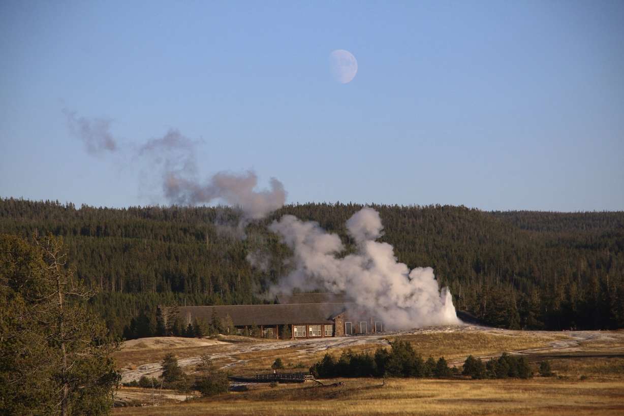 Old Faithful erupts as the moon rises over the Upper Geyser Basin at Yellowstone National Park, Mont., Sept. 25, 2023. Yellowstone was ranked the second-best place to hike according to Kuru Wednesday.