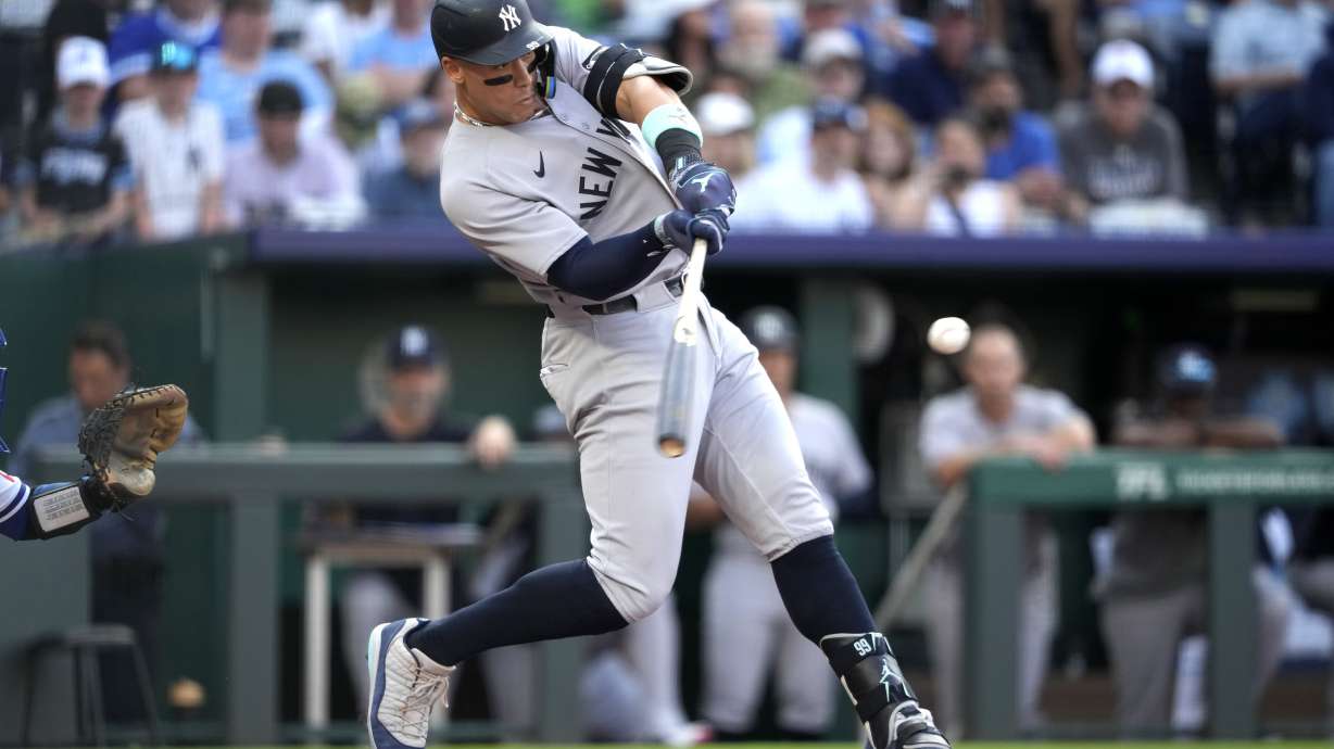 New York Yankees' Aaron Judge hits a two-run home run in the first inning during a baseball game against the Kansas City Royals, Tuesday, June 10, 2025, in Kansas City, Mo.