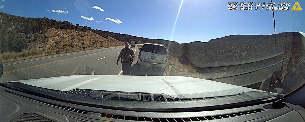 San Juan County Sheriff’s Sgt. Chaz Black walks back to his vehicle during a traffic stop on Feb. 5 near Monticello.