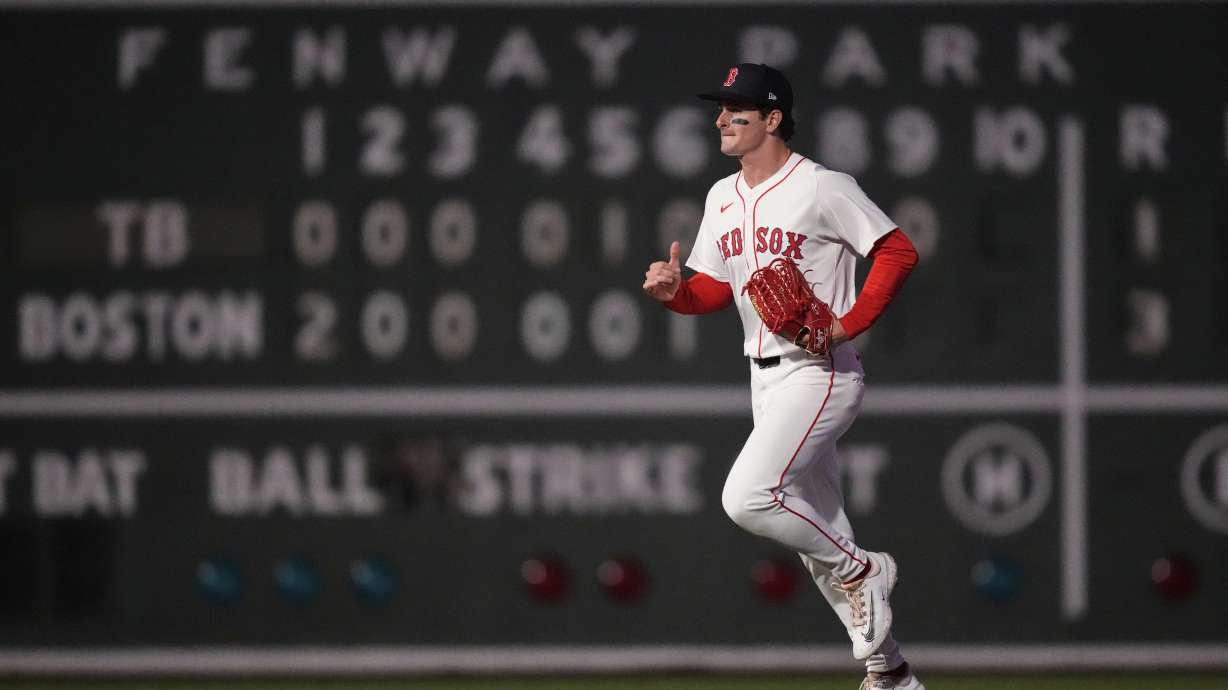 Boston Red Sox outfielder Roman Anthony heads to the dugout after defeating the Tampa Bay Rays in a baseball game at Fenway Park, Tuesday, June 10, 2025, in Boston.