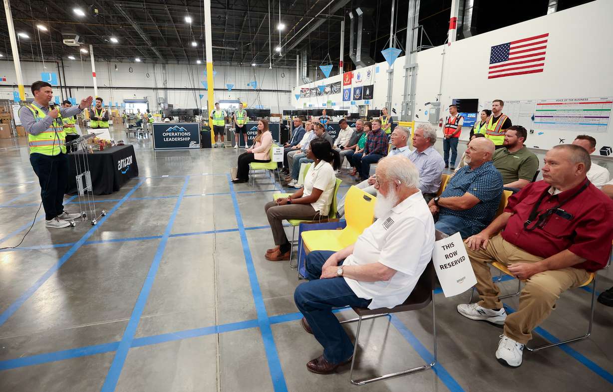 Tareq Wafaie, Amazon manager of economic development policy in Utah, speaks at a ribbon-cutting ceremony for the new Marriott-Slaterville Amazon Delivery Station, the last stop before packages are delivered to customers, in Marriott-Slaterville on Tuesday.
