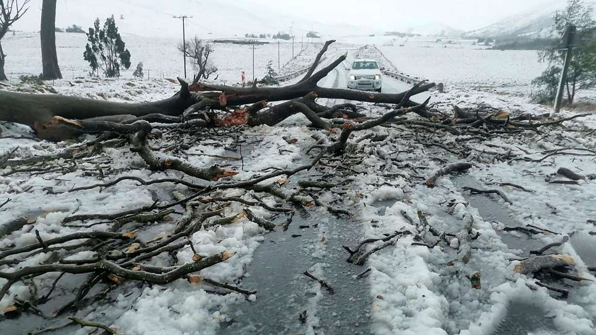 Snow covers the N2 road heading to Nolangeni, South Africa on Tuesday. At least 49 people are confirmed dead after flooding hit South Africa, including children whose school bus was swept away during the extreme weather, officials said.