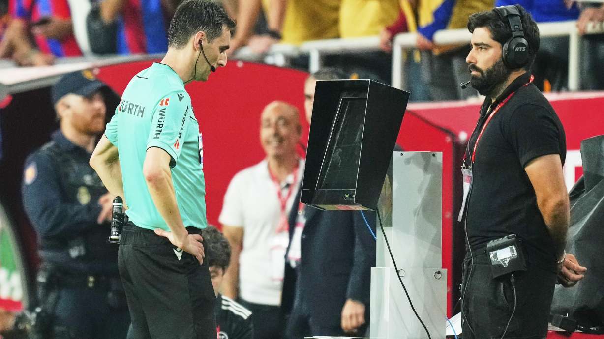 FILE - Referee Ricardo De Burgos Bengoetxea watches the VAR during the Spanish Copa del Rey final soccer match between Barcelona and Real Madrid at Estadio de La Cartuja stadium in Seville, Spain, Saturday, April 26, 2025.