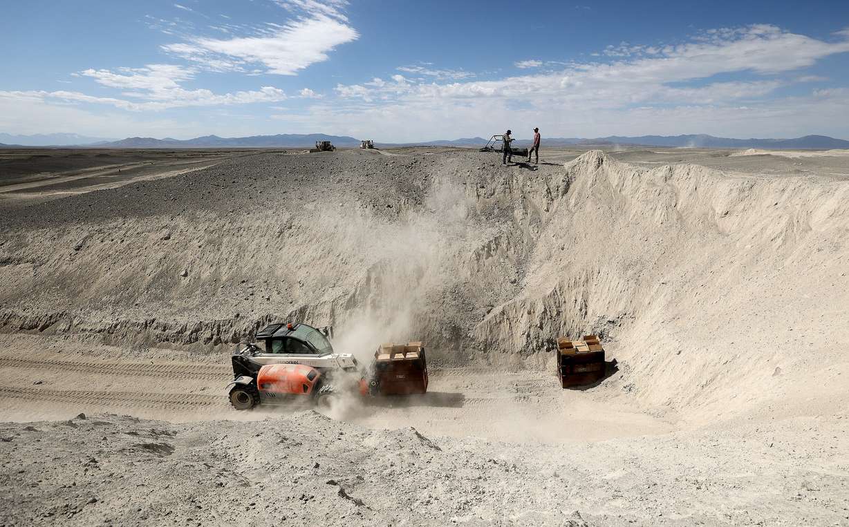 A Department of the Army civilian explosives operator moves munitions into a pit for open detonations during demilitarization operations at the Tooele Army Depot in Tooele County on Wednesday, June 11, 2025.