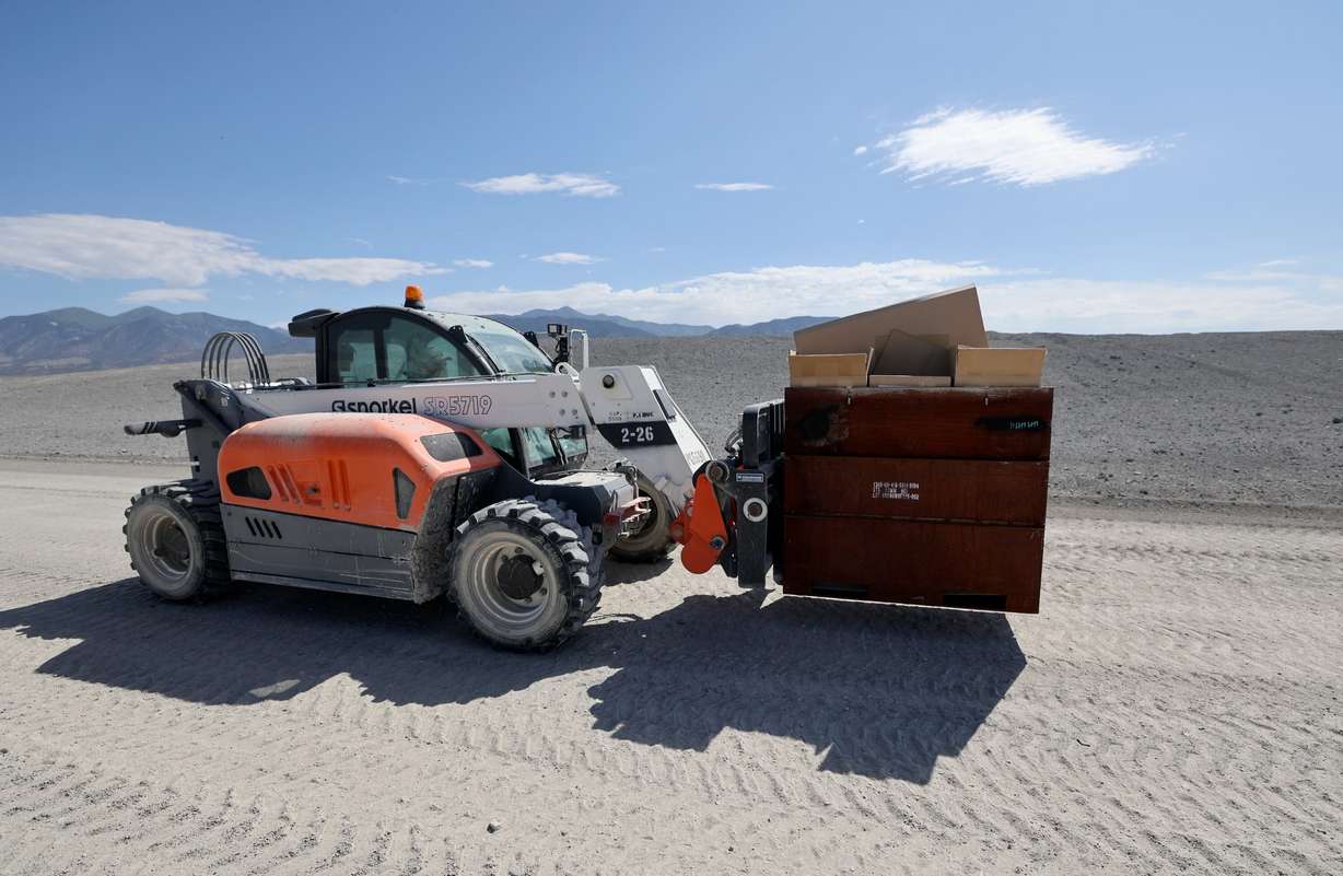 A Department of the Army civilian explosives operator moves munitions for open detonations during demilitarization operations at the Tooele Army Depot in Tooele County on Wednesday.