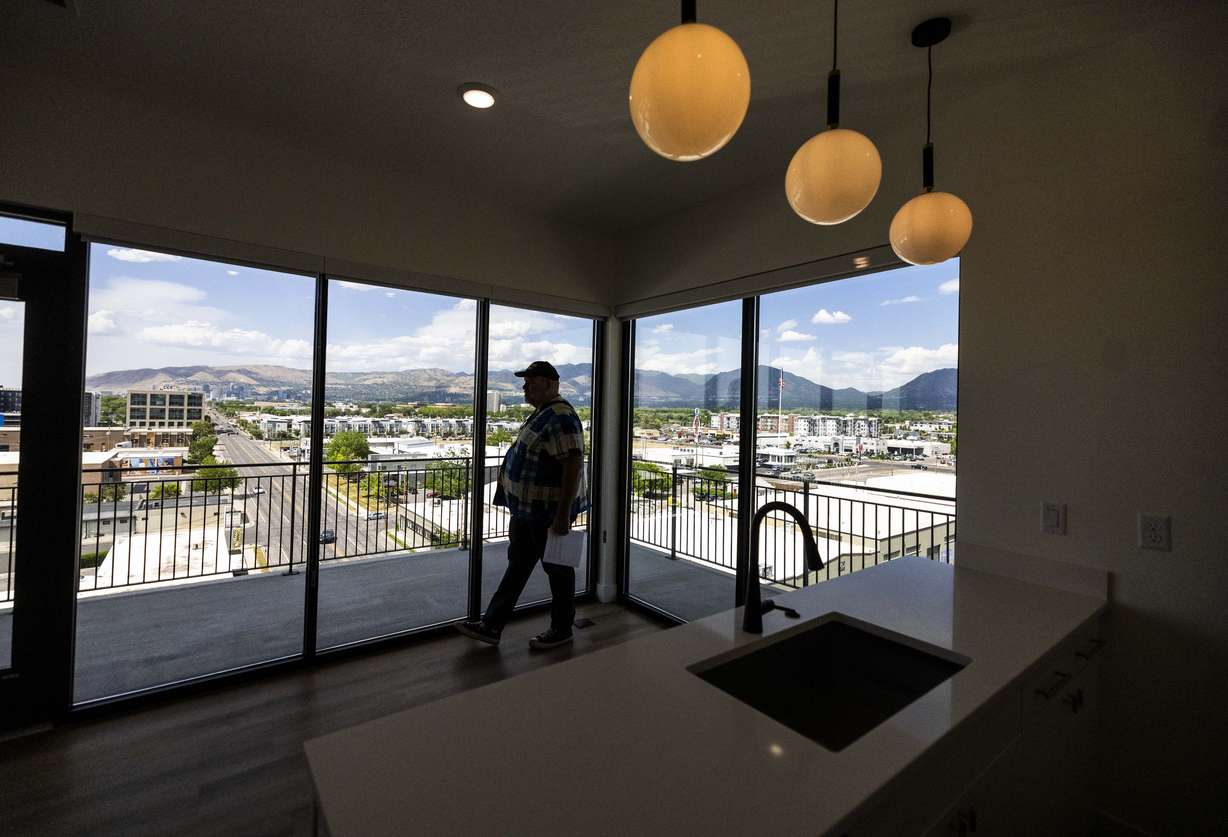 Spencer Windes tours an apartment during the grand opening of the One Burton development in downtown South Salt Lake on Wednesday. The eight-story building includes 180 rental residences across 24 floor plans, ranging from studios to two-bedroom rental units.