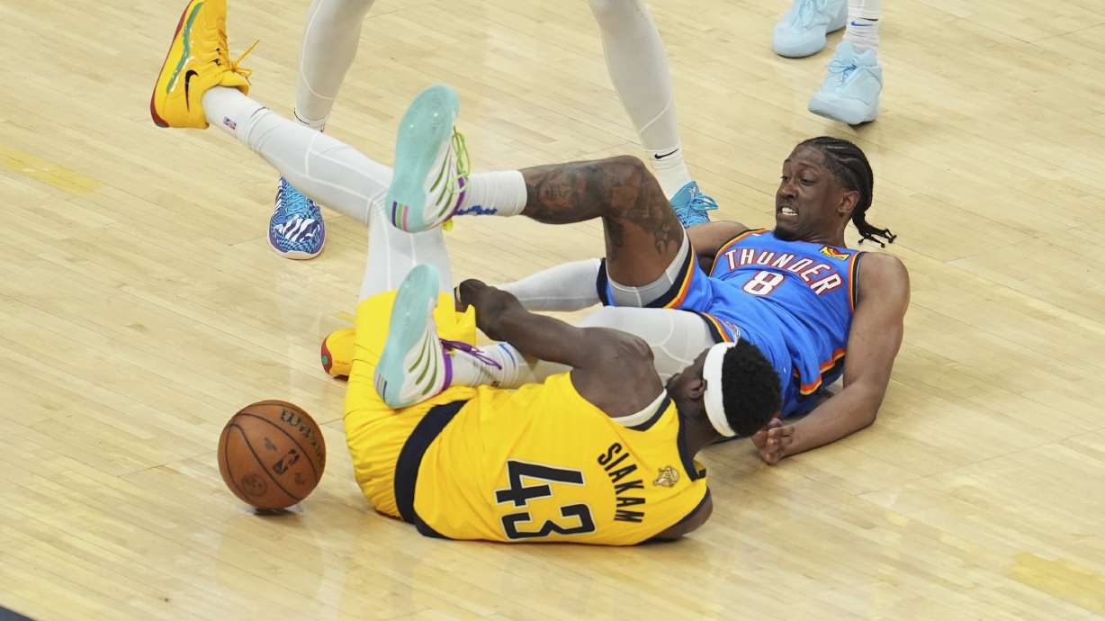 Indiana Pacers forward Pascal Siakam (43) and Oklahoma City Thunder forward Jalen Williams (8) battle for the ball during the second half of Game 3 of the NBA Finals basketball series, Wednesday, June 11, 2025, in Indianapolis.