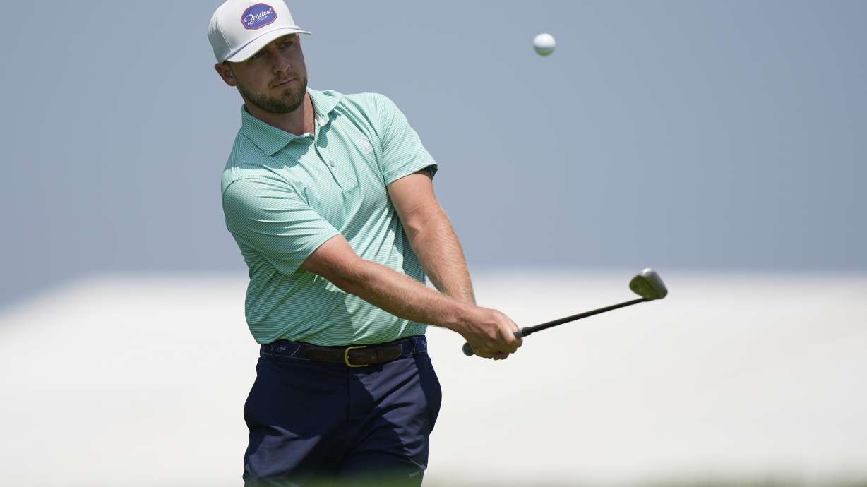 Alistair Docherty chips onto the third hole during a practice round ahead of the U.S. Open golf tournament at Oakmont Country Club Wednesday, June 11, 2025, in Oakmont, Pa.