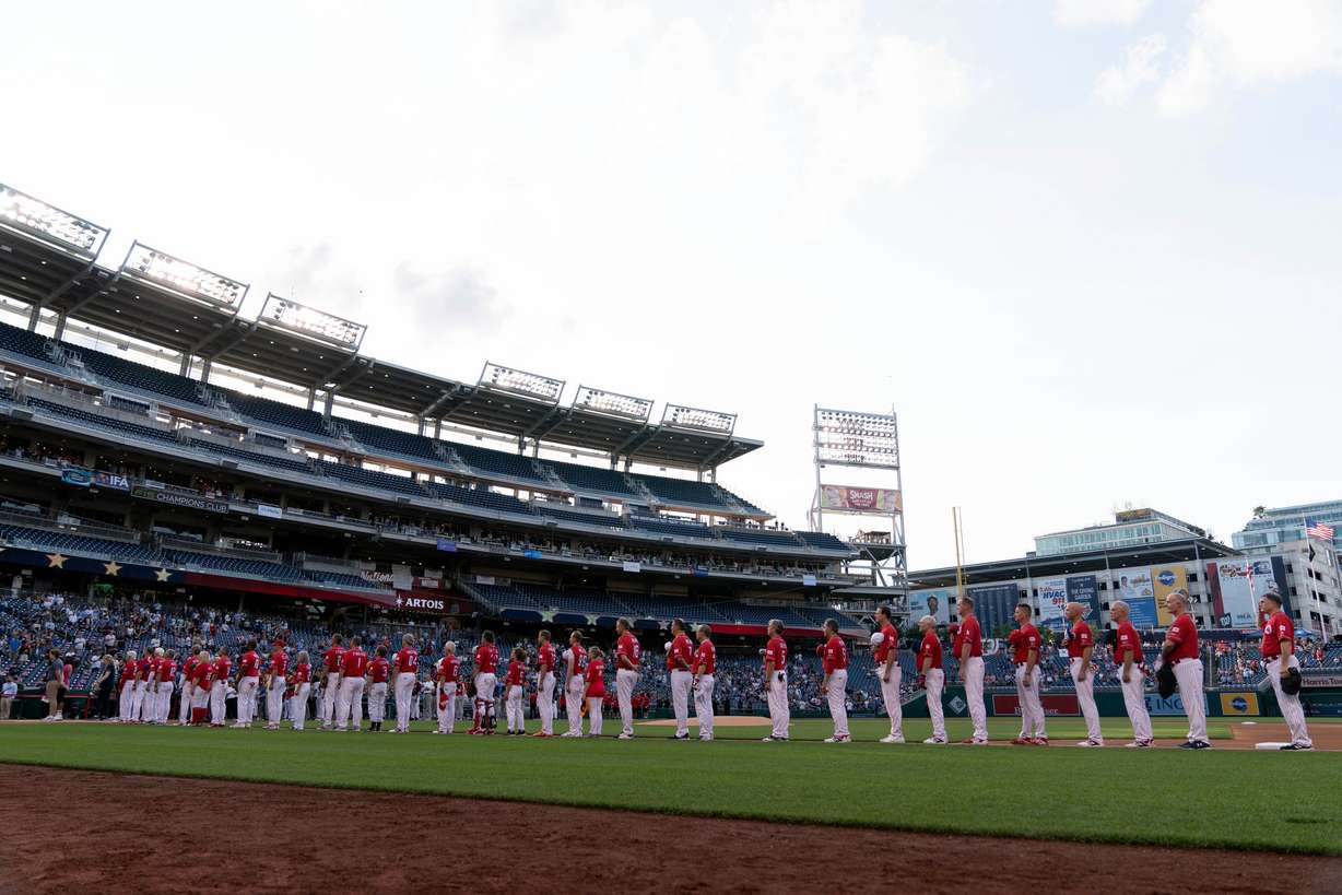 The Republican team listens to the national anthem before the game against Democrats during the Annual Congressional Baseball Game at National Park in Washington on June 14, 2023.