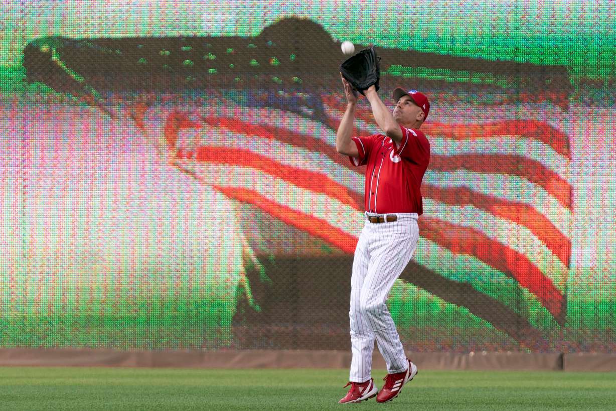Rep. Jake Ellzey, R-Texas, makes a catch during the annual congressional baseball game at Nationals Park in Washington, June 14, 2023.