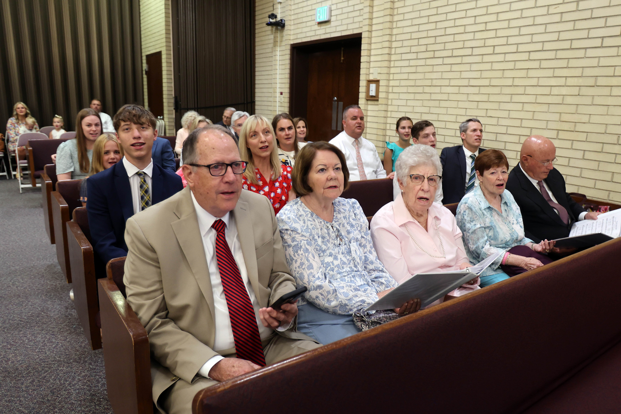Members of The Church of Jesus Christ of Latter-day Saints sing selections from “Hymns — For Home and Church” during a sacrament meeting in Murray on June 1. The church released 11 new hymns on Thursday.