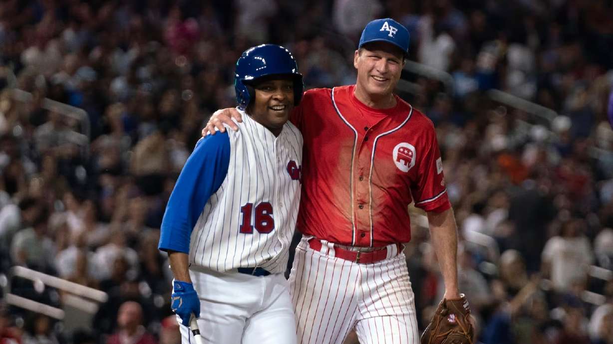 Rep. Don Davis, left, D-N.C., and Rep. August Pfluger, R-Texas, smile during the annual congressional baseball game, at Nationals Park in Washington, June 14, 2023. Republicans defeated Democrats for a fifth straight year on Wednesday.